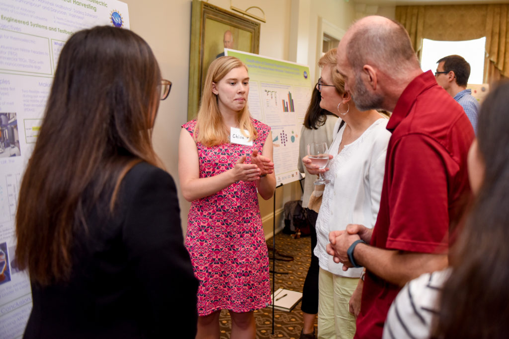 Student presenting her research at the annual research symposium.