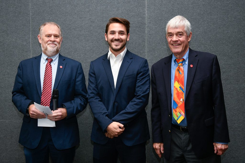 three men at awards